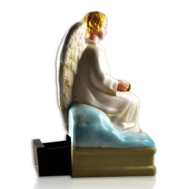 Profil de l'ange quêteur, avec le tiroir à pièces ouvert à l'arrière du socle