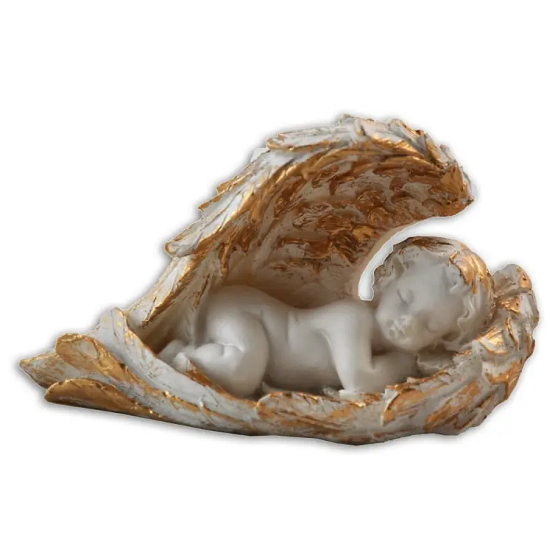 Figurine d'angelot endormi au creux de son aile dorée, la tête à droite